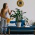 a woman watering plants