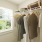 a group of clothes on a rack in a room