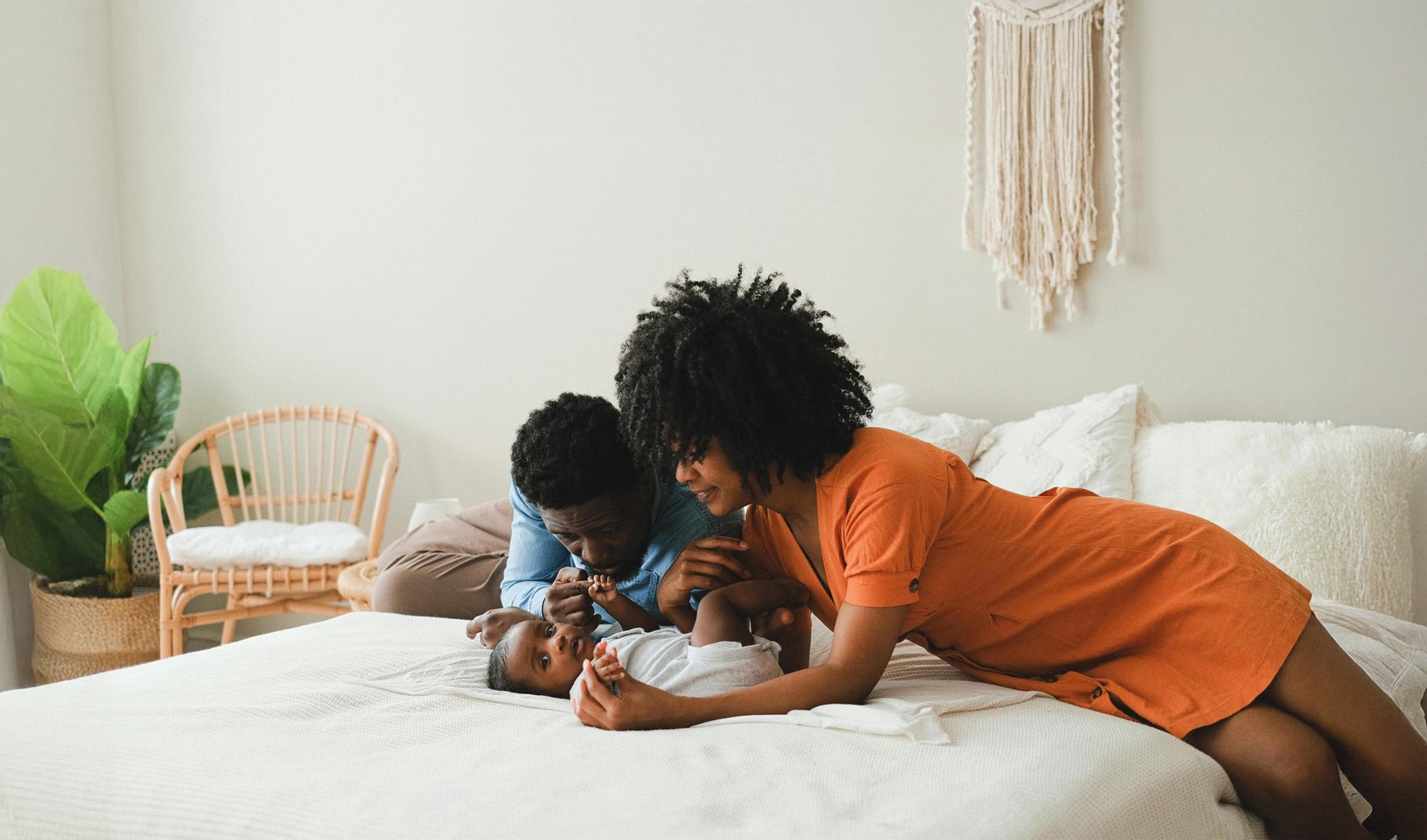 The essence of exceptional living a man and a child playing with a teddy bear on a bed