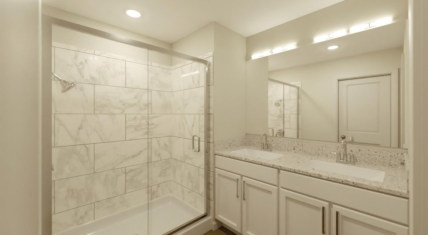 Bathroom options with thoughtful details a bathroom with a tub sink and a shower unit