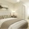 a bedroom with a bed and lamps